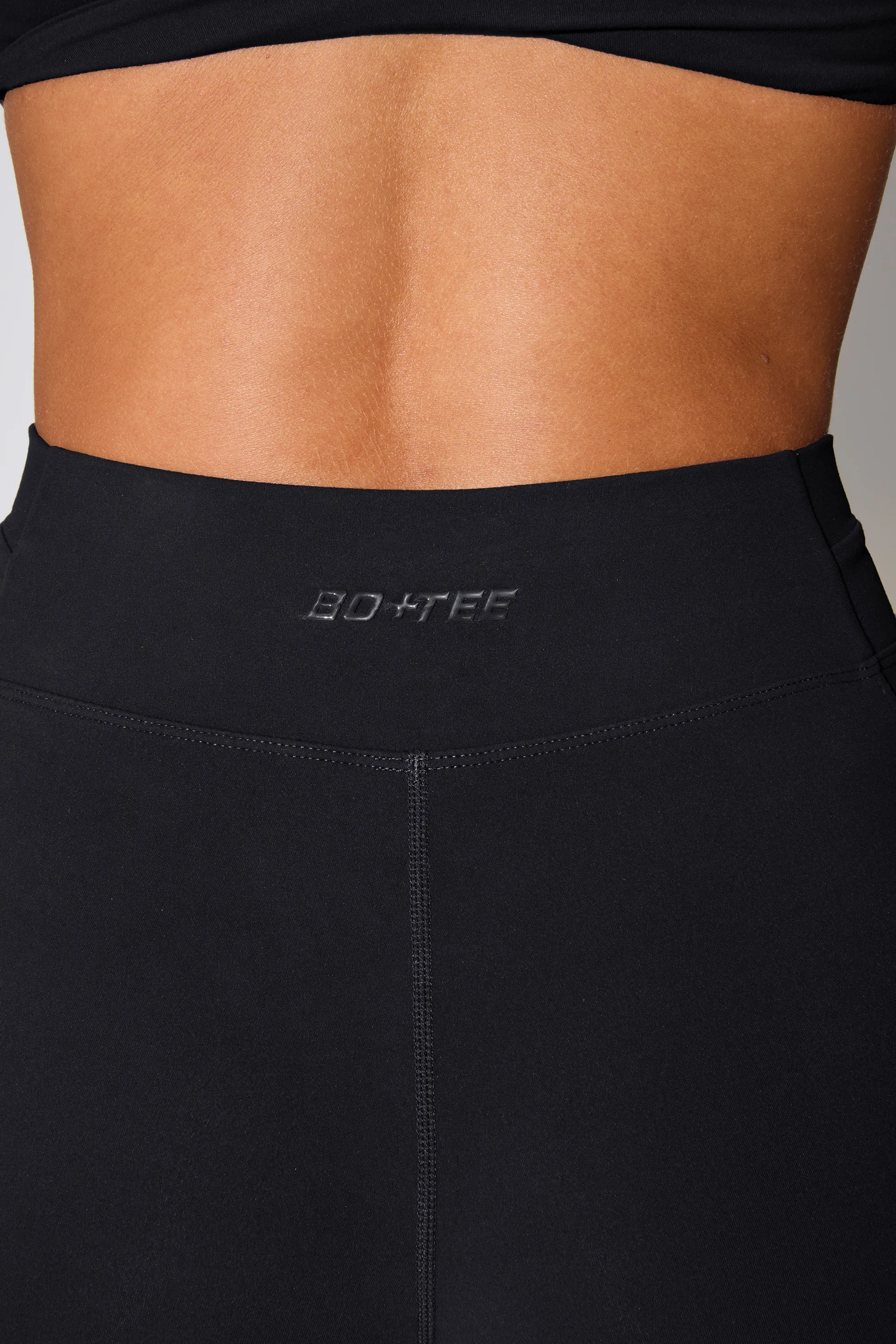 Realign - Twist Waist Flare Leggings in Black